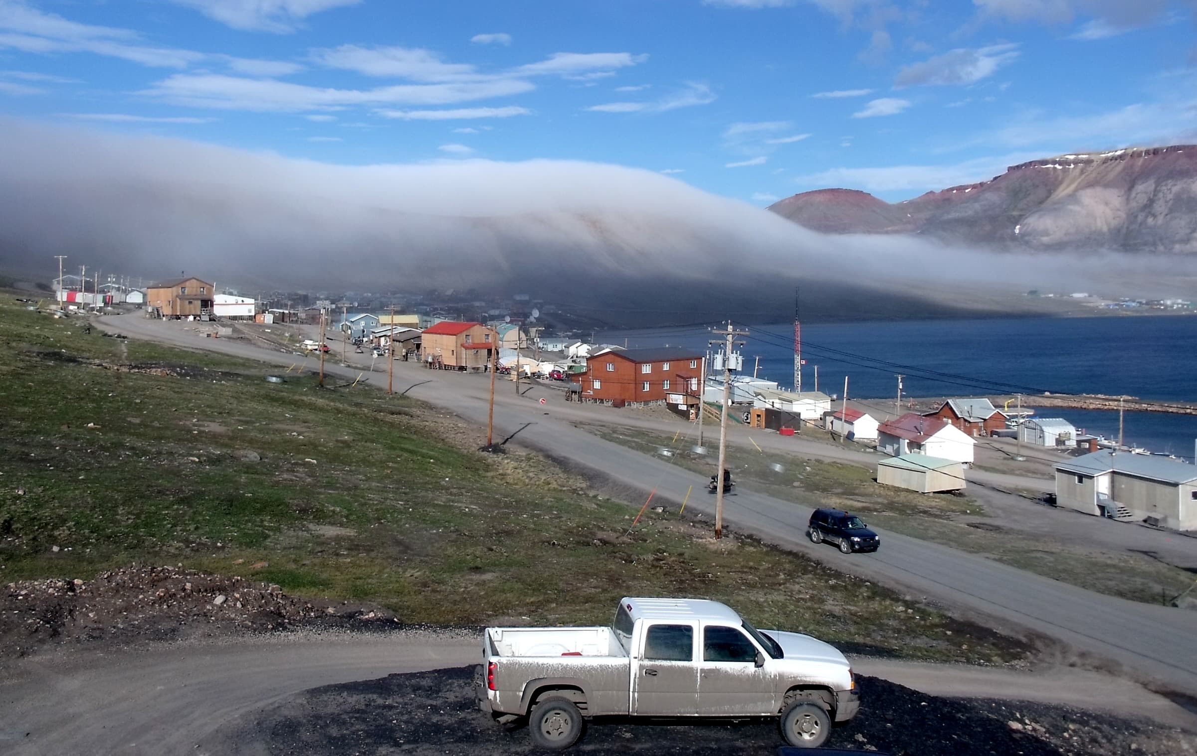Photo: Mike Beauregard from Nunavut, Canada, CC BY 2.0, via Wikimedia Commons (https://commons.wikimedia.org/wiki/File:Fog_rolling_into_Arctic_Bay.jpg)