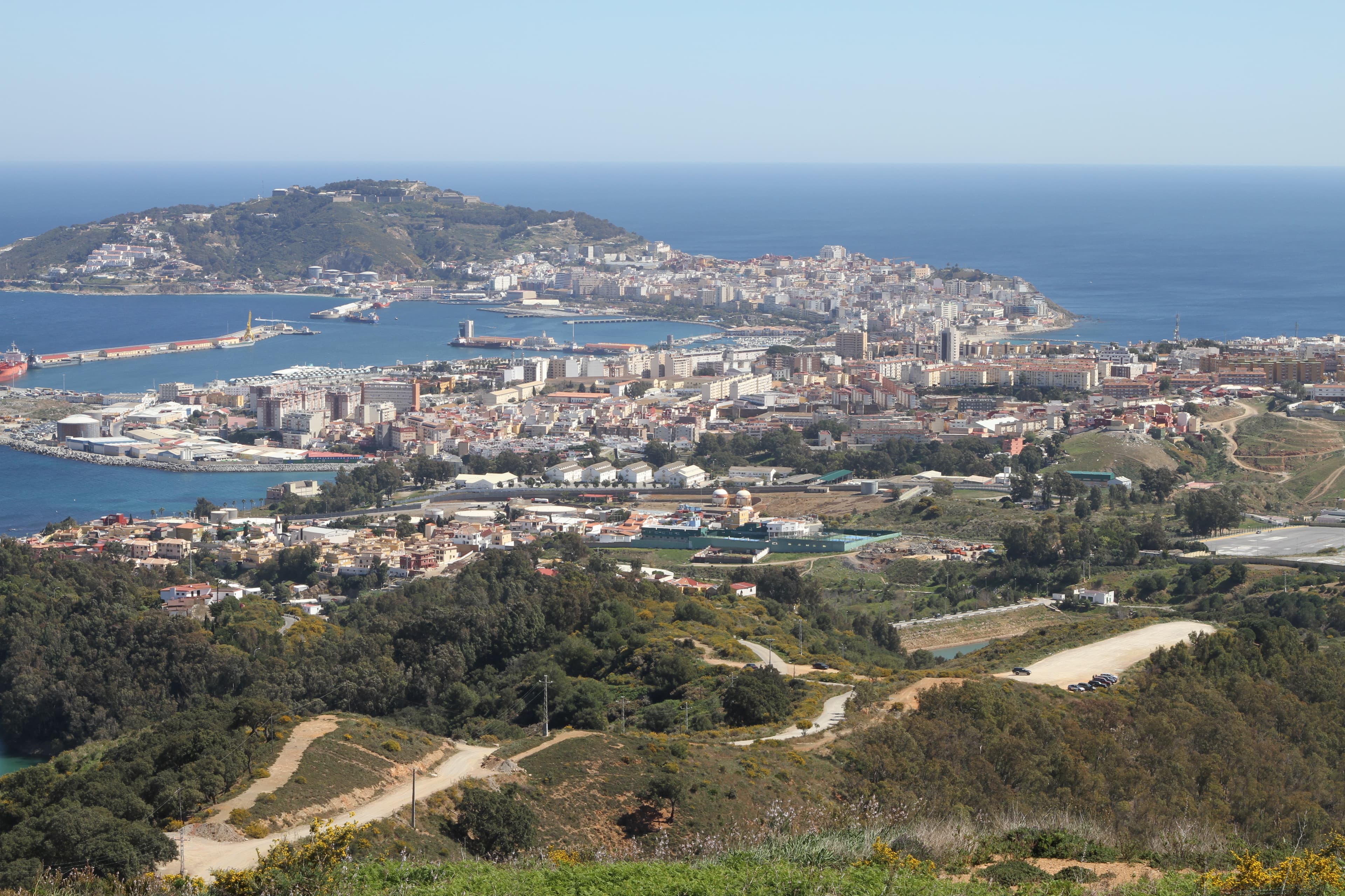 Photo: Mario Sánchez Bueno, CC BY-SA 2.0, via Wikimedia Commons (https://commons.wikimedia.org/wiki/File:Vista_de_Ceuta_y_la_pen%C3%ADnsula_de_Almina_desde_el_mirador_de_Isabel_II.jpg)