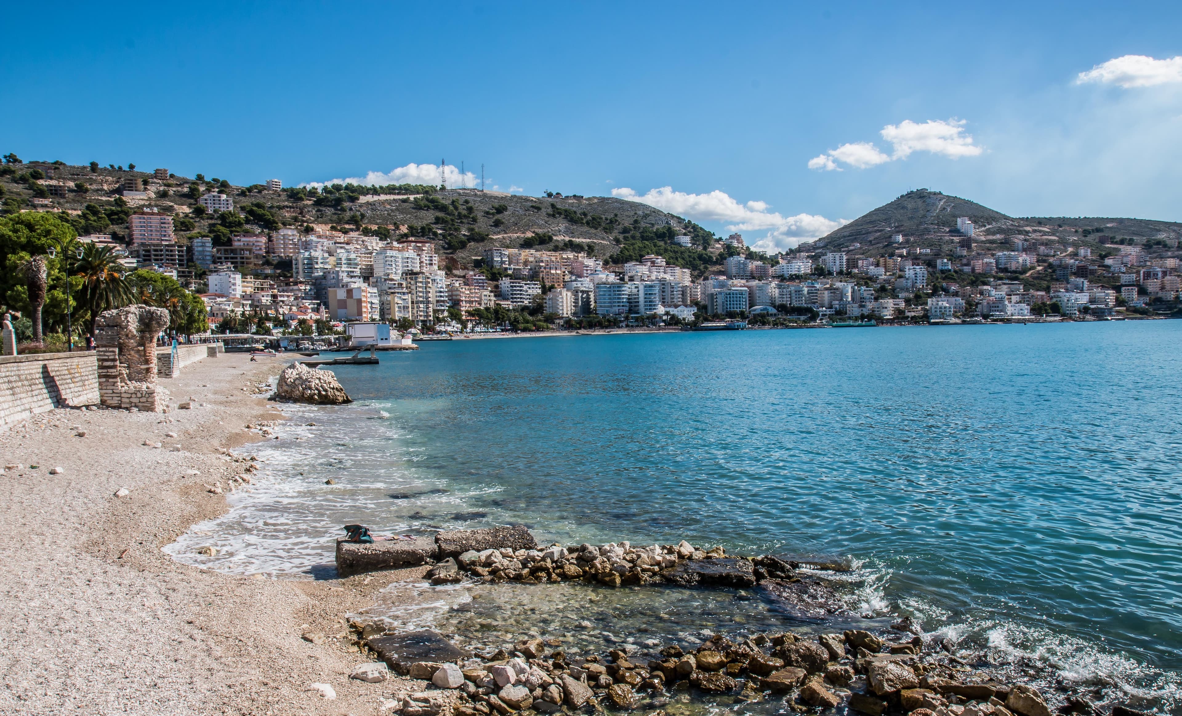 Photo: Photo: Gary Bembridge, CC BY 2.0, via Wikimedia Commons (https://commons.wikimedia.org/wiki/File:CIty_of_Saranda_Albania_2016.jpg)